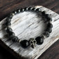 Black Onyx, Snowflake Obsidian, Larvikite, and Hematite Skull Crystal Bracelet