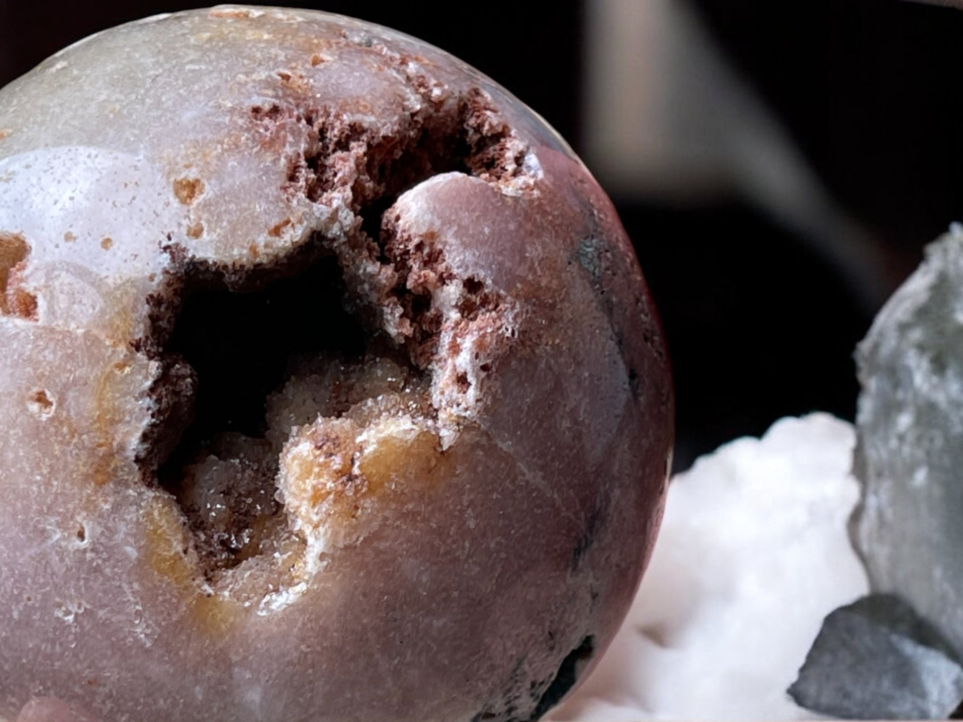 Pink amethyst crystal sphere close up druzy