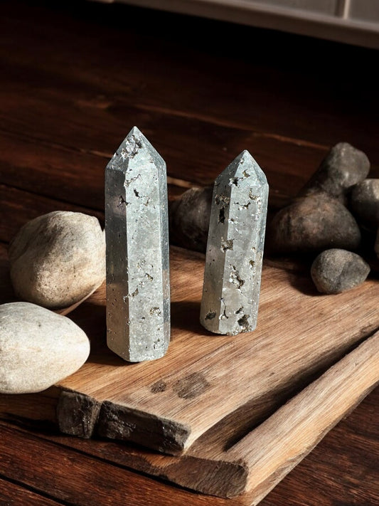 Pyrite crystal towers on wooden slab