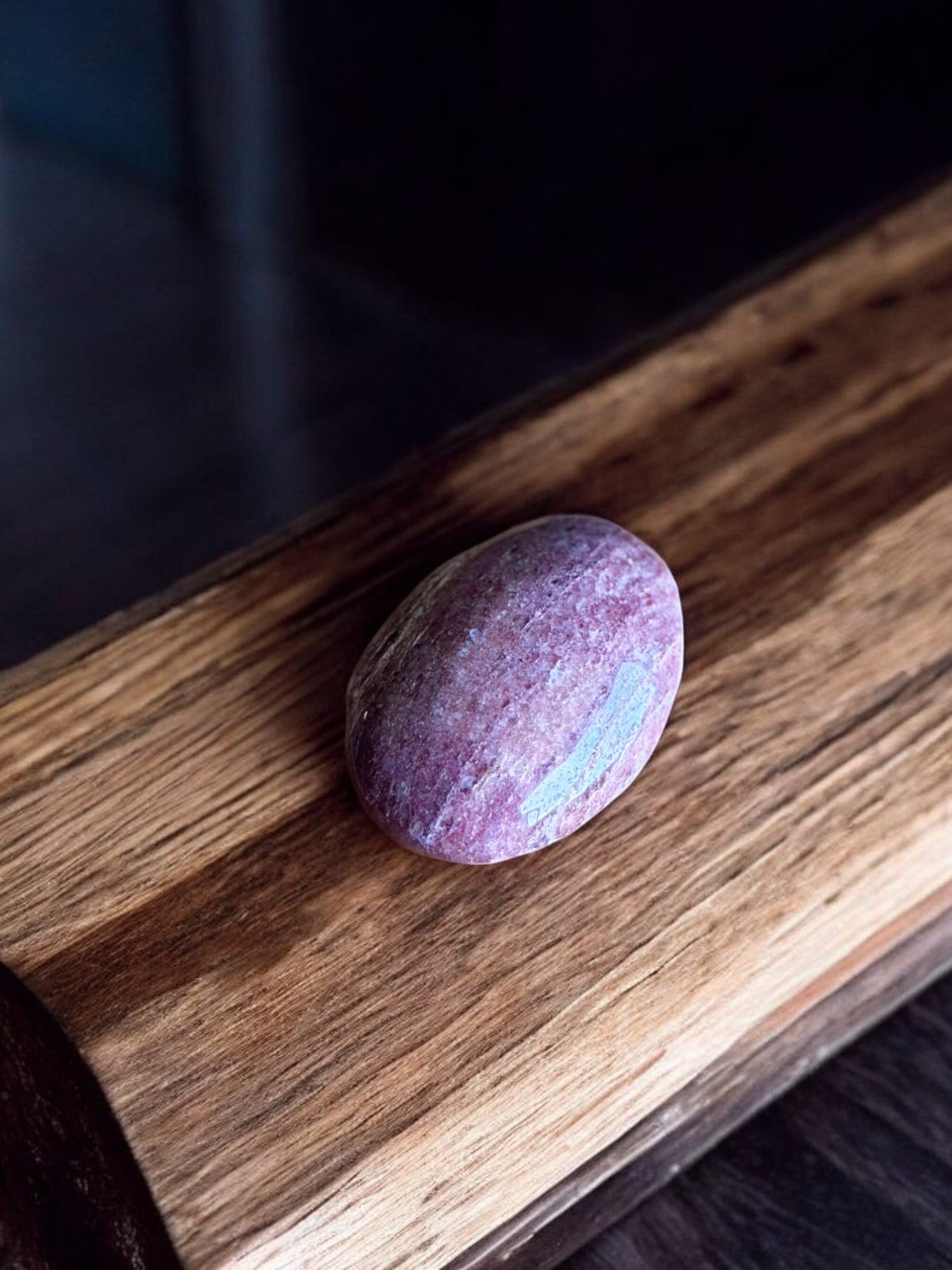 Strawberry quartz palm stone on a slab