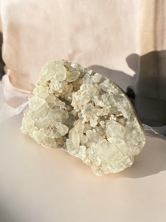 Apophyllite raw crystal cluster in a sunshine