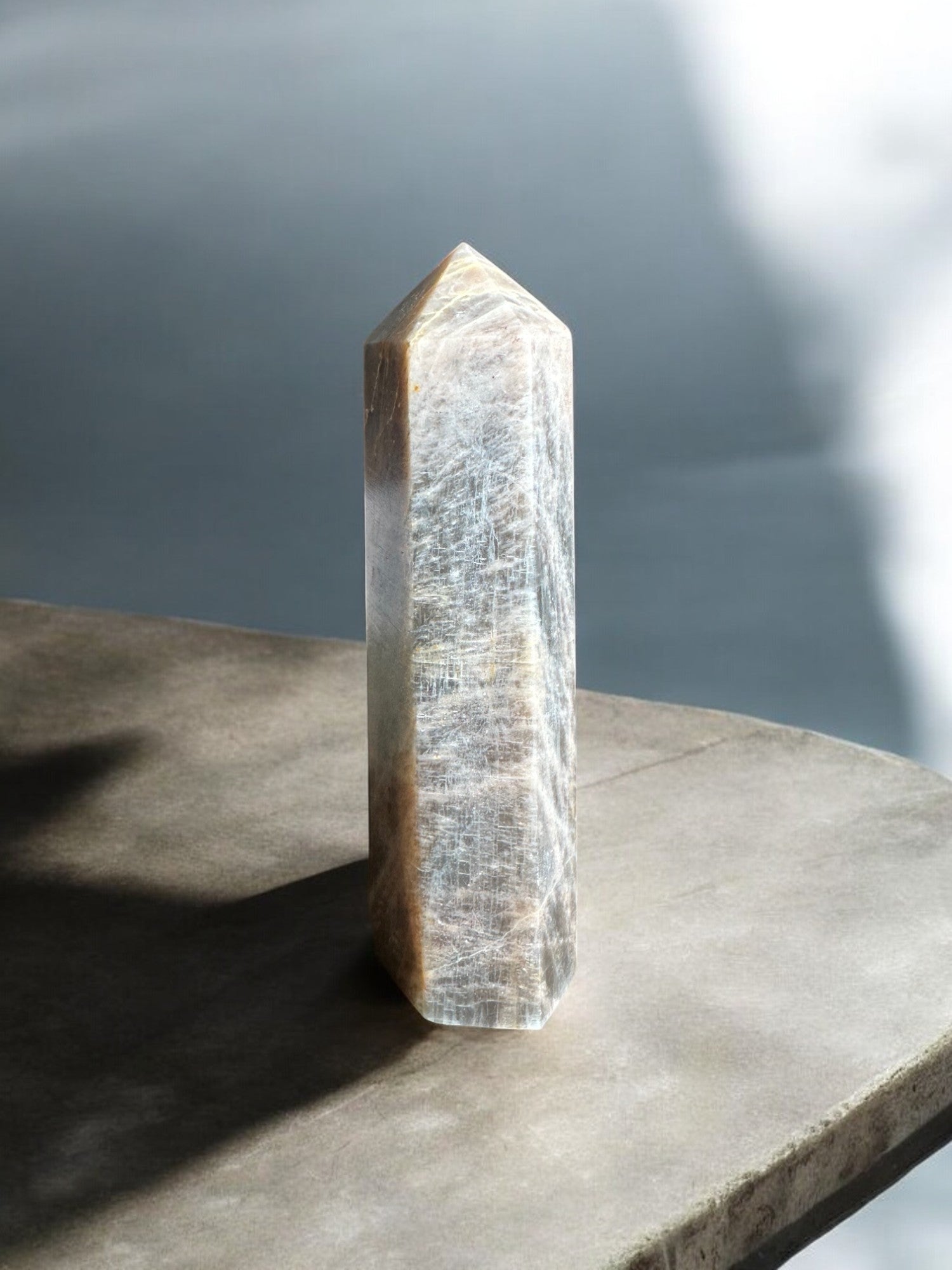 Black moonstone crystal tower on a slab