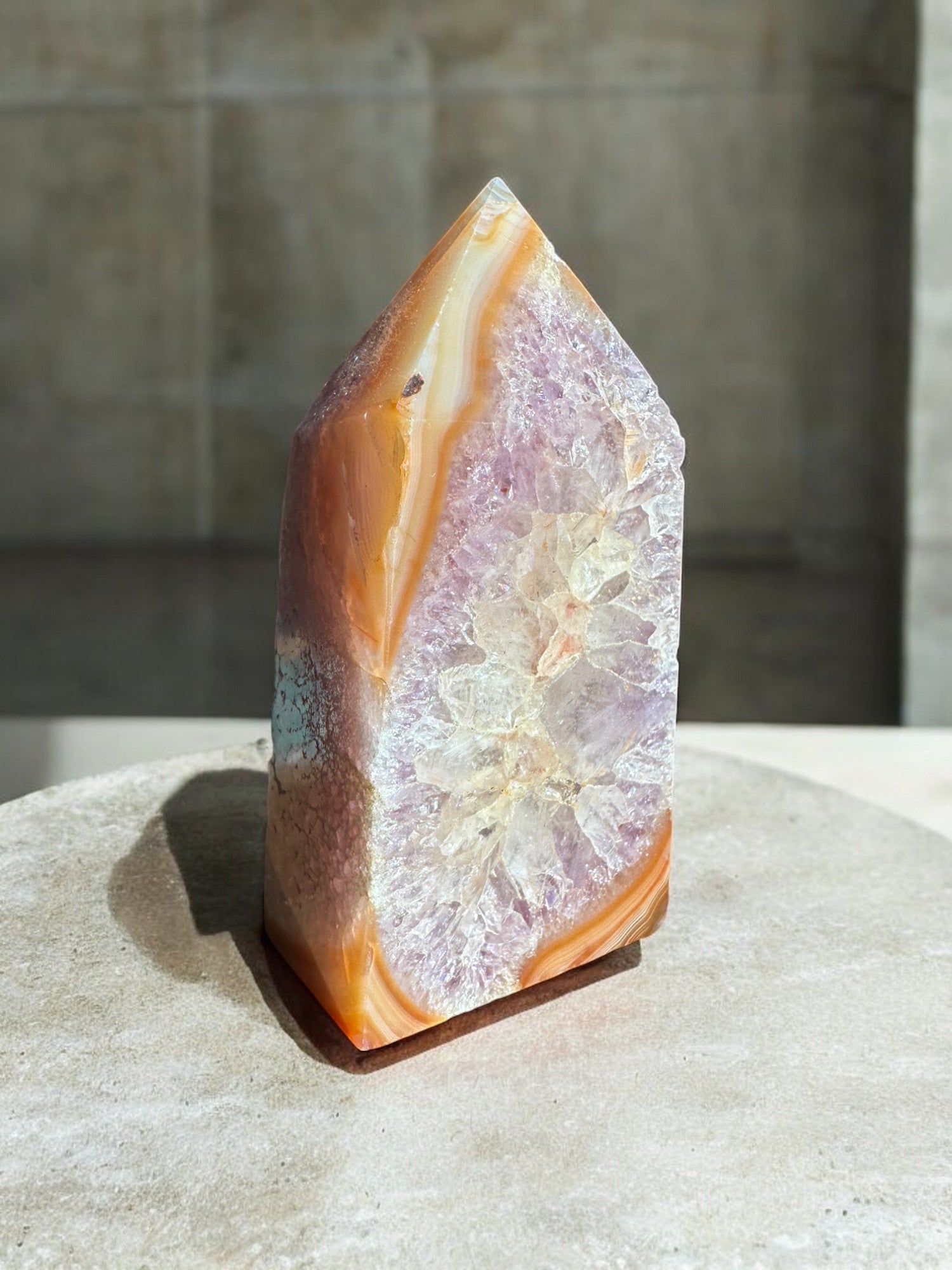 carnelian crystal tower with amethyst inclusion