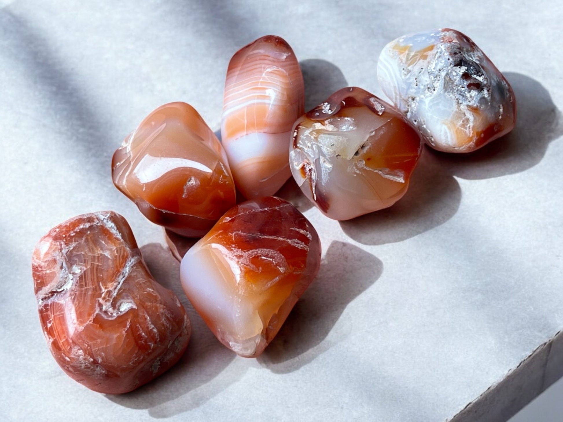 Carnelian tumbled crystals on a slab