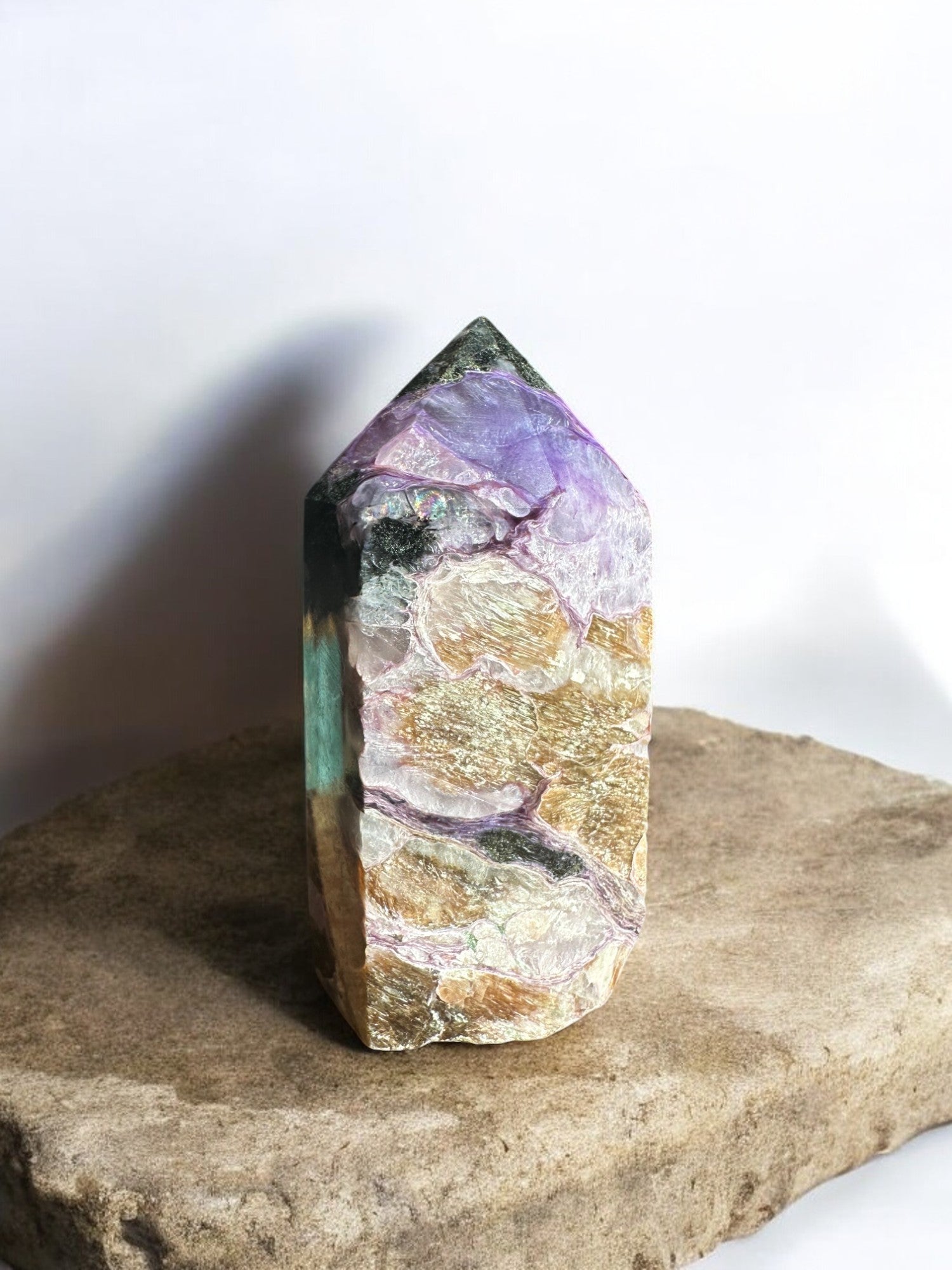 charoite crystal tower with gold inclusions