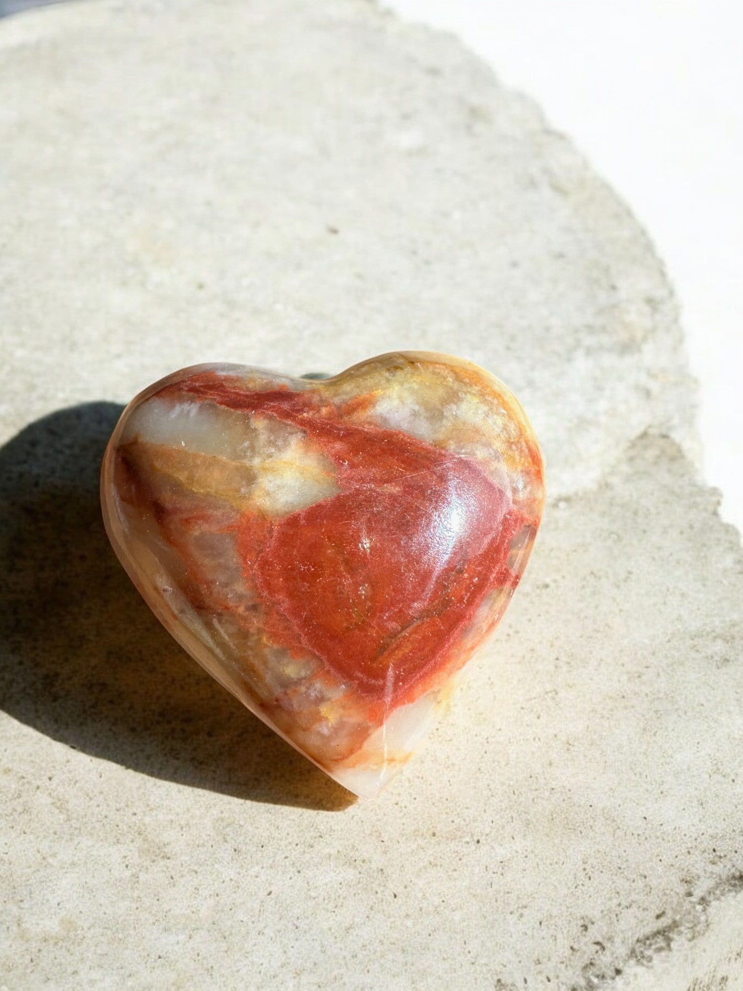 Green onyx crystal heart with iron inclusion