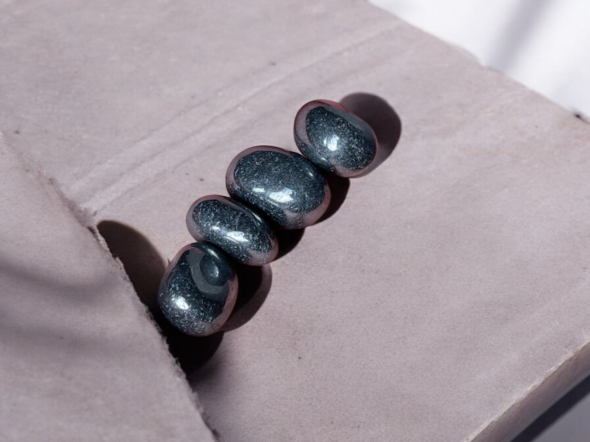 Protective hematite tumbled stones